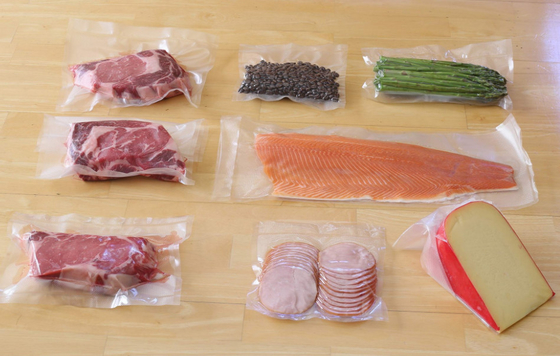 食品等級のナイロン透明な真空シール袋のロールスロイスの織り目加工のプラスチック生鮮食品